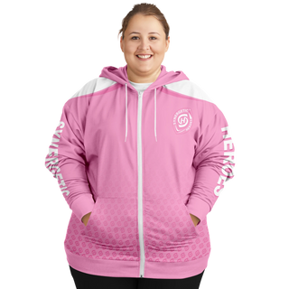 Smiling plus-size woman in a green Synergetic Heroes hoodie with bold sleeve branding, standing against a white background. This stylish, comfortable athleisure hoodie is perfect for casual wear, workouts, and active lifestyles. Shop Synergetic Heroes!