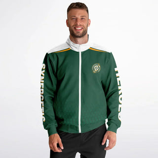 Smiling man in a green Synergetic Heroes track jacket with bold sleeve branding, standing against a white background. This stylish, comfortable athletic jacket is perfect for casual wear, workouts, and active lifestyles. Shop Synergetic Heroes!