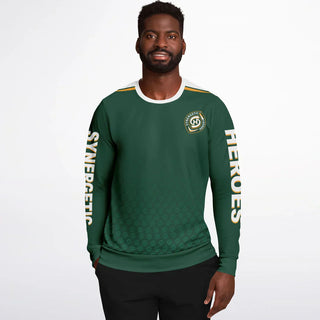 Smiling man in a green Synergetic Heroes long-sleeve shirt with bold sleeve branding, standing against a white background. This stylish, comfortable athletic shirt is perfect for casual wear, workouts, and active lifestyles. Shop Synergetic Heroes!