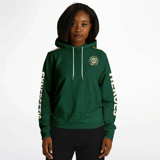 Confident woman in a green Synergetic Heroes hoodie with bold sleeve branding, standing against a white background. This stylish, comfortable athleisure hoodie is perfect for casual wear, workouts, and active lifestyles. Shop Synergetic Heroes apparel!